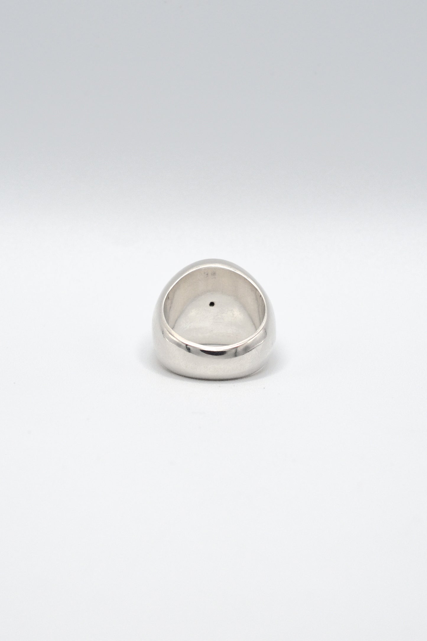 Silver ring on a white background